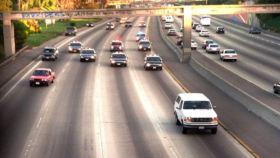 In this June 17, 1994, file photo, a white Ford Bronco, driven by Al Cowlings carrying O.J. Simpson, is trailed by Los Angeles police cars as it travels on a freeway in Los Angeles. Simpson’s ex-wife, Nicole Brown Simpson, and her friend Ron Goldman were found stabbed to death outside her LA home. Simpson is later arrested after a widely televised freeway chase in the vehicle.