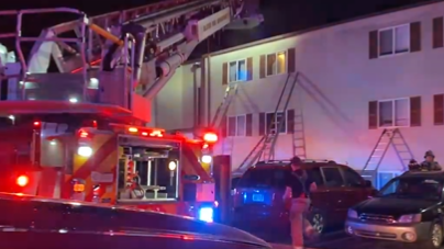 Olathe firefighters rescue family from burning apartment building