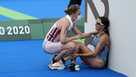In this July 27, 2021, file photo, Claire Michel of Belgium is assisted by Lotte Miller of Norway after the finish of the women's individual triathlon competition at the 2020 Summer Olympics, in Tokyo, Japan. In this July 27, 2021, file photo, Claire Michel of Belgium is assisted by Lotte Miller of Norway after the finish of the women's individual triathlon competition at the 2020 Summer Olympics, in Tokyo, Japan.