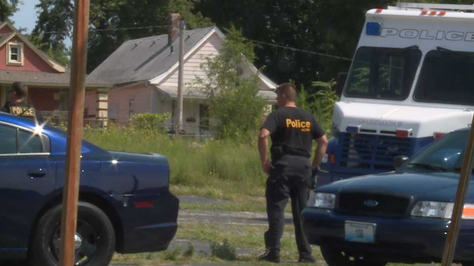 Police call in tactical team after man tosses bricks off KC building