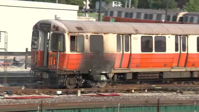 Dozens of passengers jump from the windows of an Orange Line train that caught fire