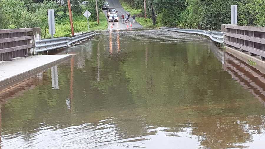 This photo shows flooding on the bridge at the intersection of Royalston and Mill Yard roads in Orange, Massachusetts on July 18, 2021. Town officials declared a state of emergency due to the level of flooding.