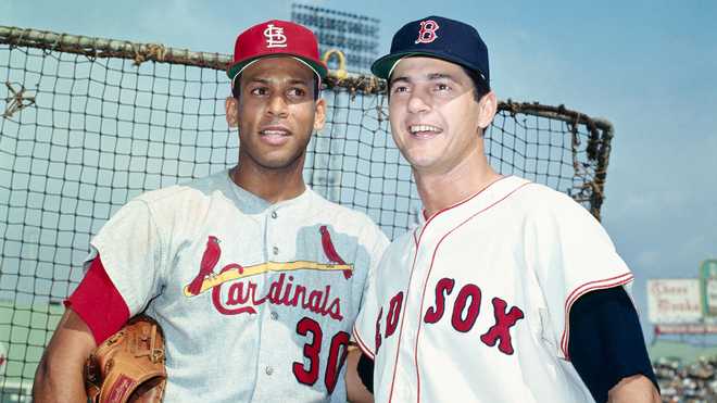 Orlando Cepeda of the St. Louis Cardinals and Carl Yastrzemski of the Boston Red Sox stand together before the start of Game 2 of the 1967 World Series. #x20;Oct. 5, 1967. Cepeda won the 1967 National League Most Valuable Player award, while Yastrzemski won the 1967 American League MVP award.
