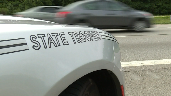 Troopers: Man hospitalized with life-threatening injuries after crash between car, tractor-trailer
