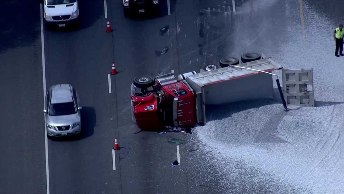 Overturned dump truck spills gravel on beltway's outer loop