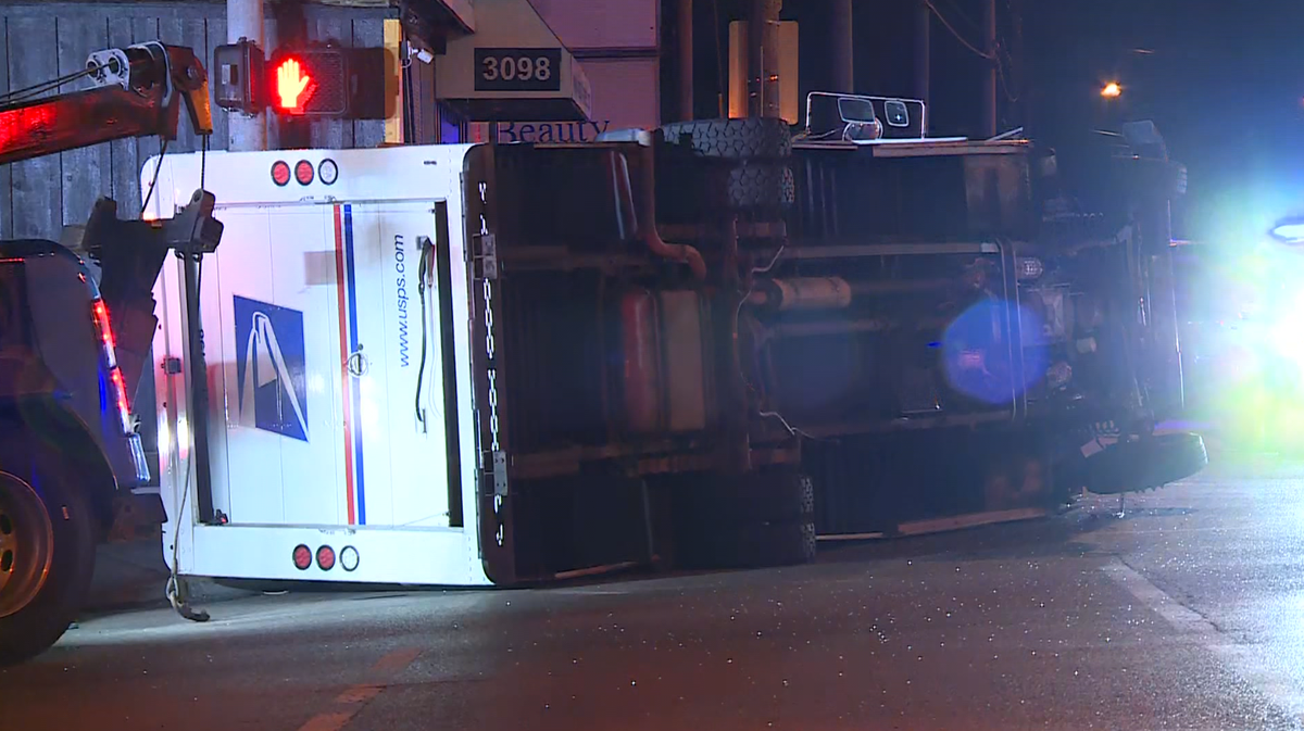 Emergency crews on scene after mail truck overturned in Westwood