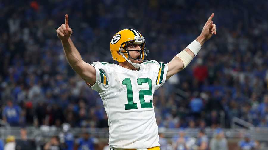 Green Bay Packers quarterback Aaron Rodgers (12) celebrates his 9-yard touchdown pass to wide receiver Davante Adams against the Detroit Lions during an NFL football game in Detroit, Sunday, Jan. 1, 2017.