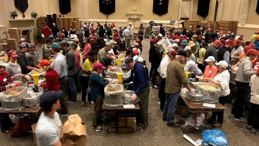 Volunteers pack meals for the hungry