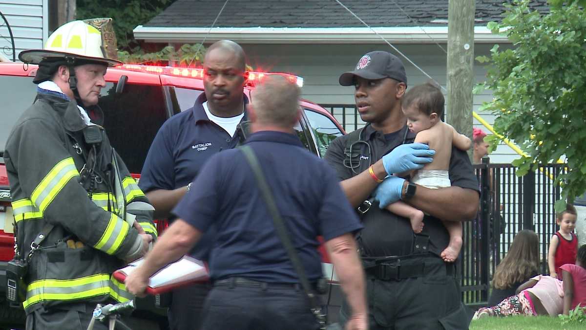 Witnesses: Five children dropped out of burning home, caught below
