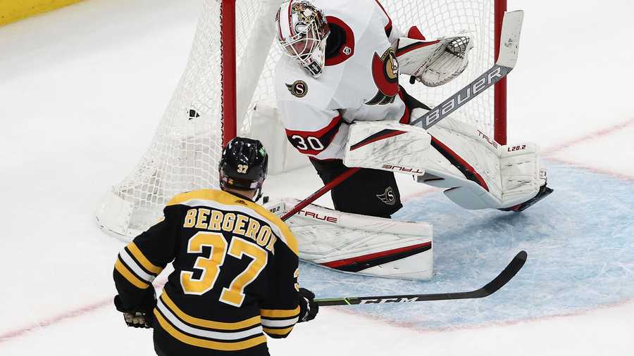 Boston Bruins' Patrice Bergeron scores on Ottawa Senators goaltender Matt Murray during the second period of an NHL hockey game Tuesday, Nov. 9, 2021, in Boston. (AP Photo)