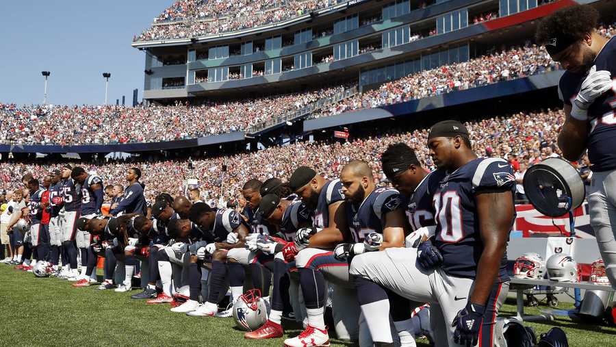 Several New England Patriots players kneel during the national anthem before an NFL football game against the Houston Texans, Sunday, Sept. 24, 2017, in Foxborough, Mass. 