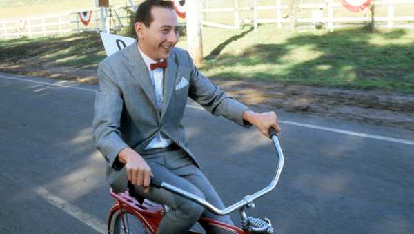 Paul Reubens rides a bike in a scene from the film 