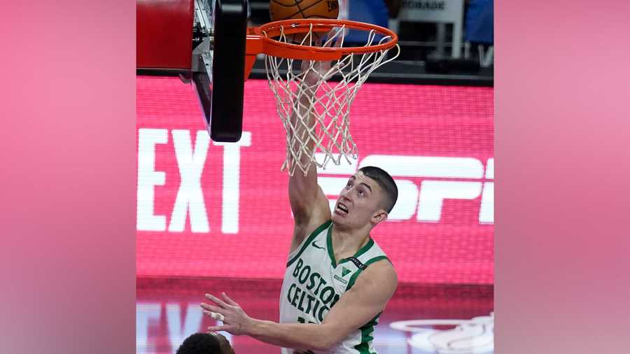 Boston Celtics guard Payton Pritchard (11) scores the game winning basket during the second half of an NBA basketball game against the Miami Heat, Wednesday, Jan. 6, 2021, in Miami. The Celtics defeated the Heat 107-105. (AP Photo)