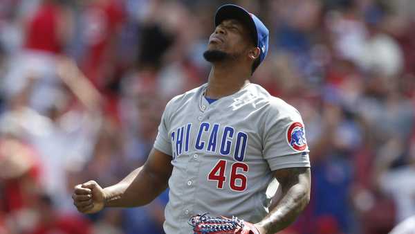 Chicago Cubs relief pitcher Pedro Strop (46) reacts to the team's 6-3 win over the Cincinnati Reds in a baseball game, Sunday, Aug. 11, 2019, in Cincinnati. (AP Photo/Gary Landers)