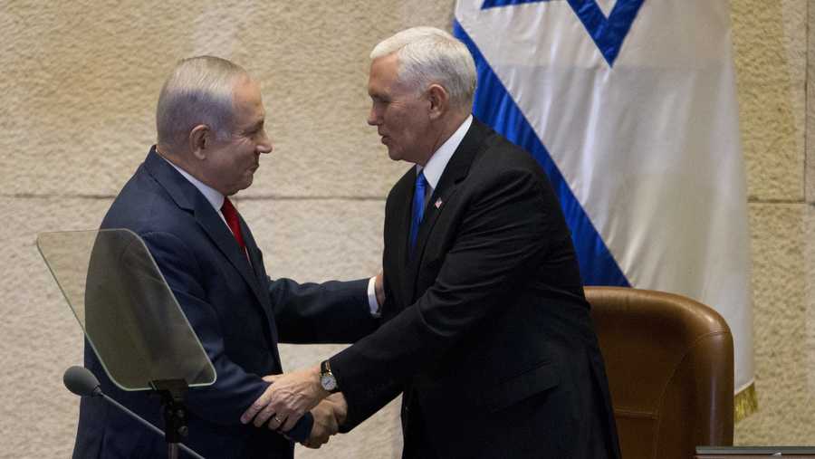 Israel's Prime Minister Benjamin Netanyahu, left, shake hands with U.S. Vice President Mike Pence in Israel's parliament in Jerusalem, Monday, Jan. 22, 2018.