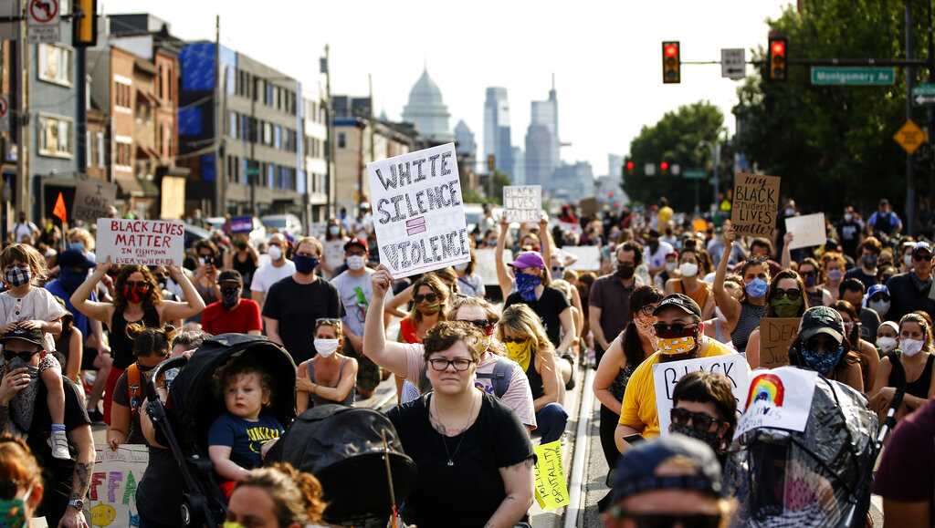 Police officer facing charges after using baton to strike protester's ...