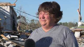 A woman found a piano in the rubble of a church destroyed by a tornado, and decided to play in front of TV cameras.