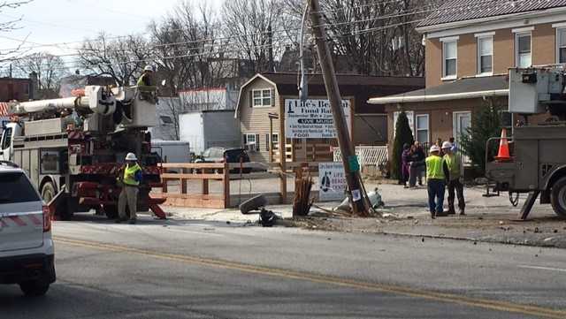 Video: Car crashes into utility pole, knocks out power