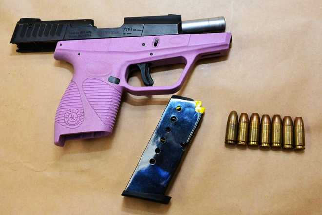 Pink Gun Bullets New 'hot mug shot' impresses internet admirers
