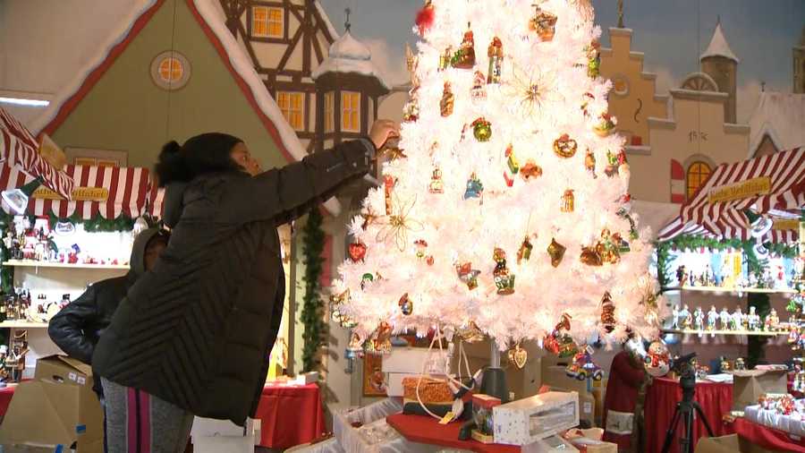 Organizers work to set up the Christmas Village, which will be open from Thanksgiving to Christmas Eve,
