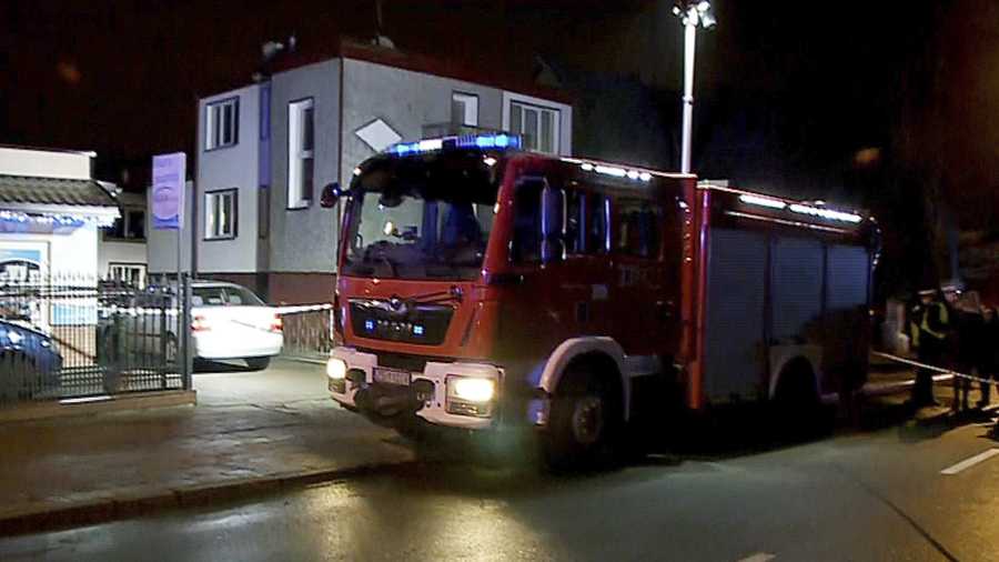 A fire engine stands outside an "Escape Room" game location in Koszalin, northern Poland, on Friday, Jan. 4, 2019. A fire broke out at the "Escape Room" game location, killing five teenage girls and injuring a man, authorities said.