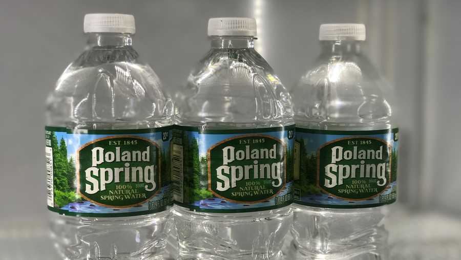 Poland Spring bottled water sits in a cooler in a store in Needham, Mass.