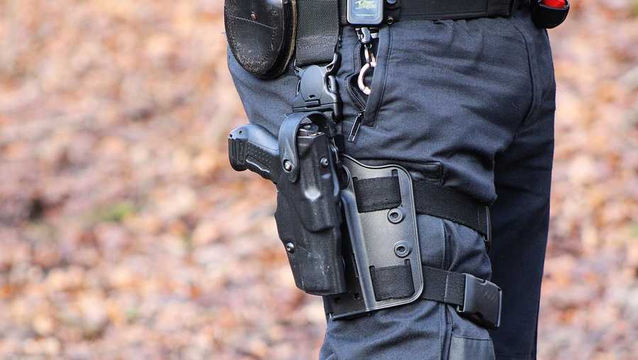 Police sidearm and handcuffs