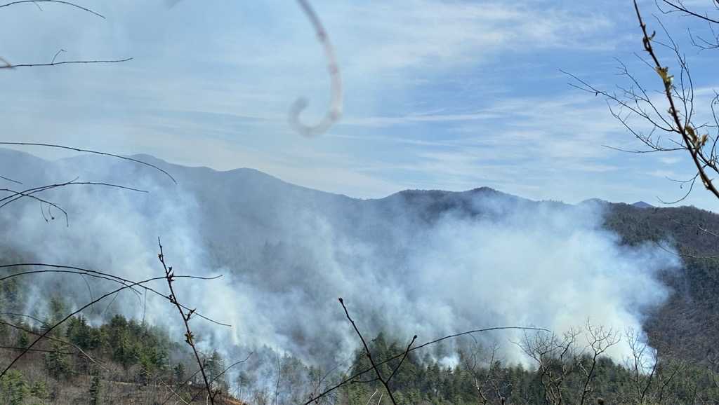 Firefighters work to contain two wildfires in Western North Carolina mountains