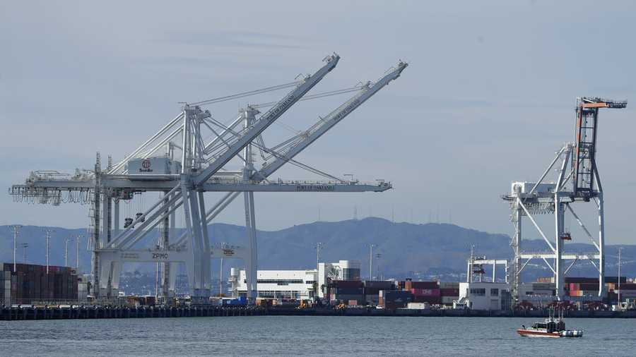 Cranes are shown at the Port of Oakland in Oakland, Calif., Tuesday, March 10, 2020. (AP Photo/Jeff Chiu)