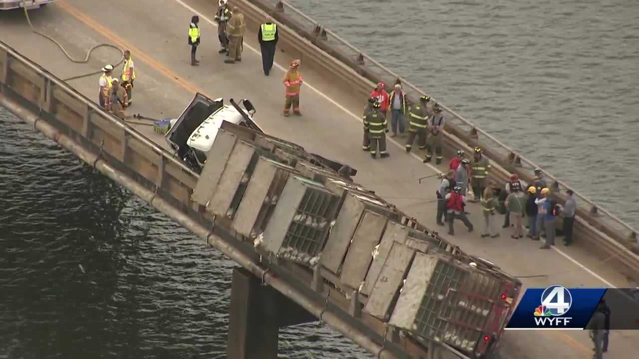 Victim identified in deadly crash that left chicken truck dangling