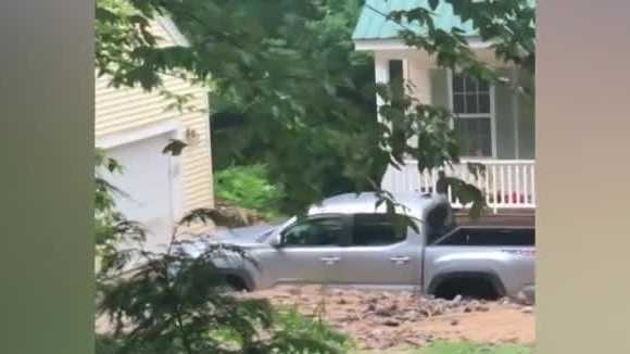 Pickup truck buried in debris from flooding in Madison - Vimarsana News
