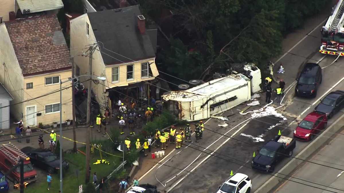 Garbage truck crashes into Etna home while mother, two young children