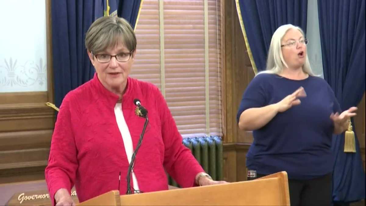 Kansas governor says masks required for state workers, visitors in