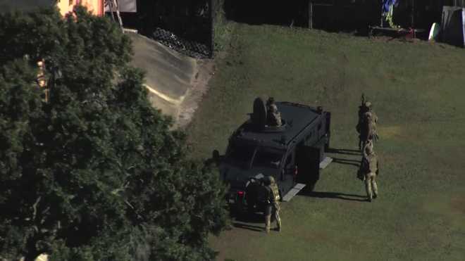 Chopper 2 is on scene where law enforcement has surrounded a building on Edgewater Drive and Lee Road