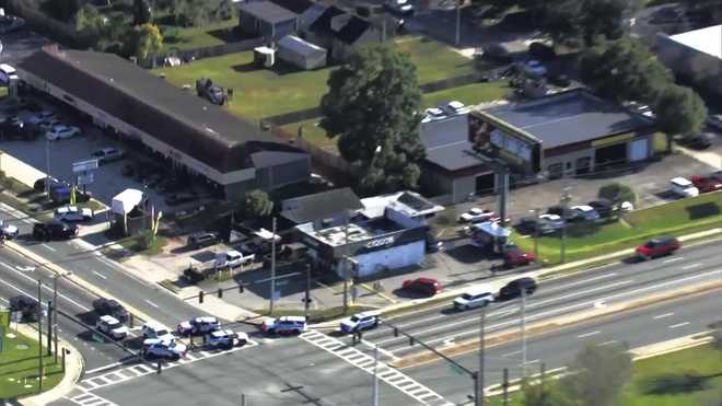 Chopper 2 is on scene where law enforcement has surrounded a building on Edgewater Drive and Lee Road