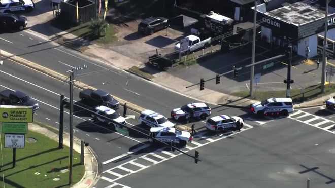 Chopper 2 is on scene where law enforcement has surrounded a building on Edgewater Drive and Lee Road