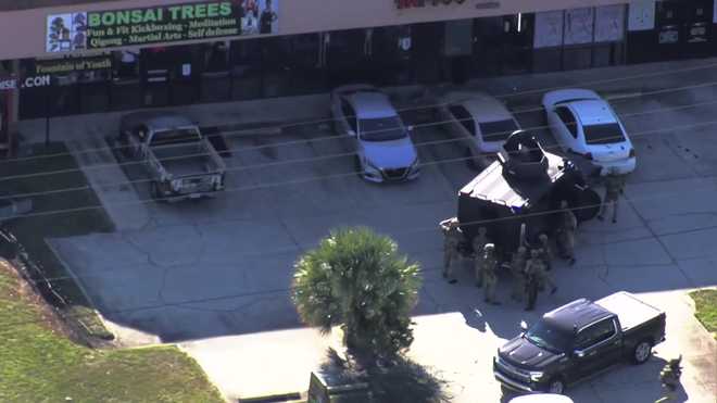 Chopper 2 is on scene where law enforcement has surrounded a building on Edgewater Drive and Lee Road