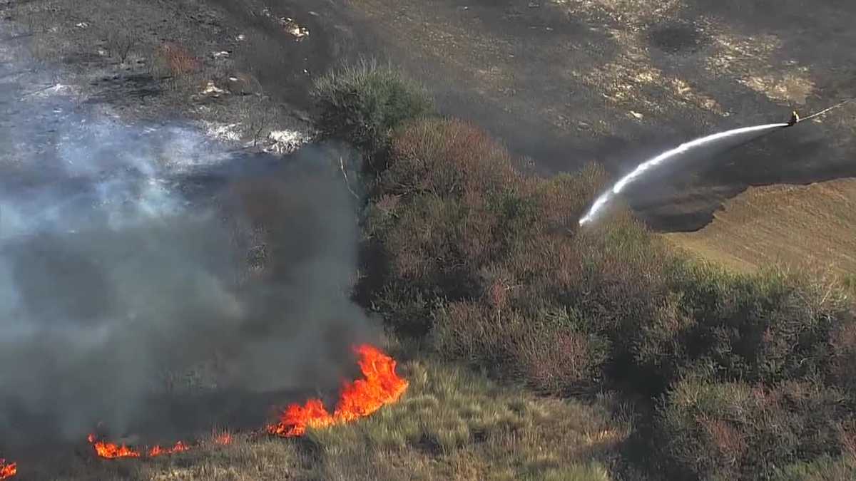 1.5-acre brush fire burns near homes in Orange County subdivision