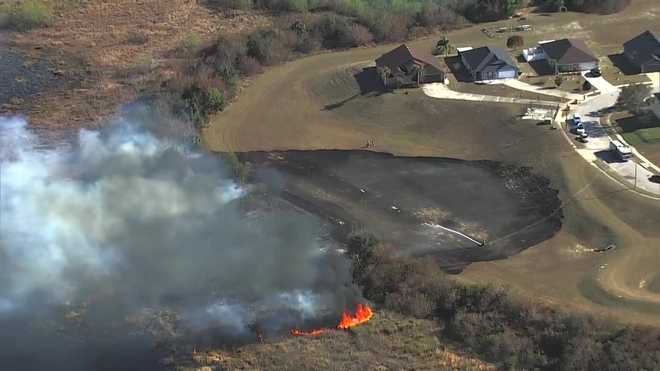 1.5-acre brush fire burns near homes in Orange County subdivision