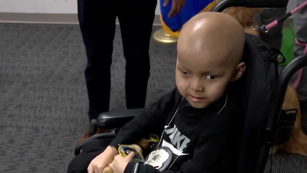 Meet the newest member of the force: Milwaukee police surprise young boy fighting cancer