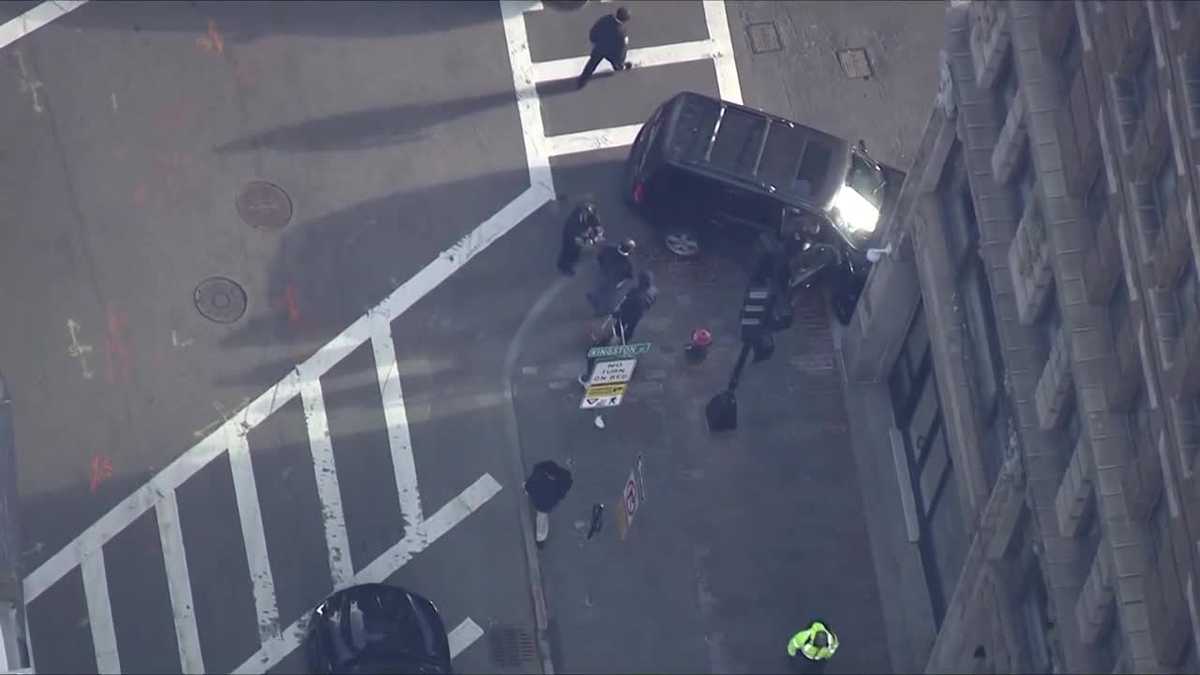 Pedestrian injured, SUV hits Boston building in crash