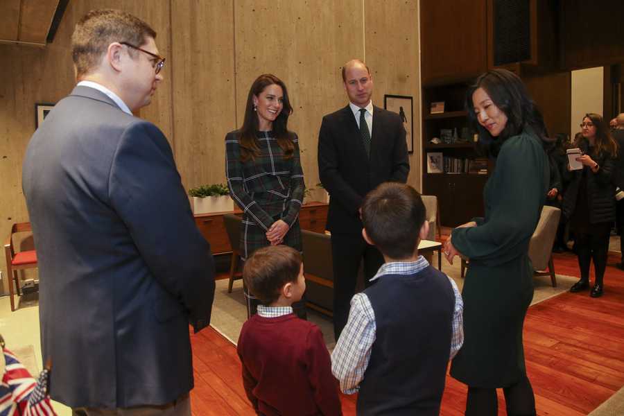 Britain&apos;s Prince William and Kate, Princess of Wales, chat with Boston Mayor Michelle Wu, right, and her family, from left, husband Conor Perwarski and sons Blaise and Cass in her office at Boston City Hall on Wednesday, Nov. 30, 2022 in Boston.  (AP Photo/Reba Saldanha)