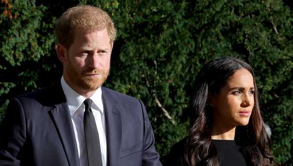 Prince Harry, Duke of Sussex, and Meghan, Duchess of Sussex on the long Walk at Windsor Castle arrive to view flowers and tributes to HM Queen Elizabeth on Sept. 10, 2022 in Windsor, England.