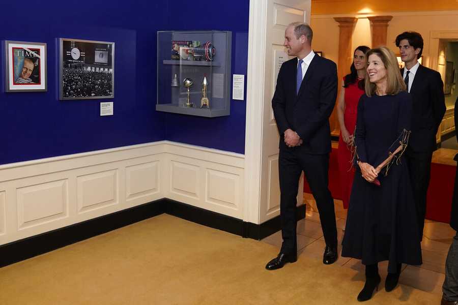 Britain&apos;s Prince William tours a space exhibit with U.S. Ambassador to Australia Caroline Kennedy, daughter of President Kennedy, and her children Tatiana and Jack at the John F. Kennedy Presidential Library, Friday, Dec. 2, 2022, in Boston. (AP Photo/Charles Krupa, Pool)