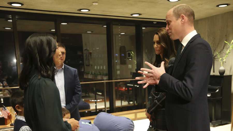 Britain&apos;s Prince William and Kate, Princess of Wales, chat with Boston Mayor Michelle Wu hand er sons Blaise and Cass in her office at Boston City Hall on Wednesday, Nov. 30, 2022 in Boston.  (Stuart Cahill/The Boston Herald via AP, Pool)