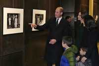 Britain's Prince William points to a 1970&apos;s photograph of Queen Elizabeth and then-Boston Mayor Kevin White with touring Boston City Hall with Kate, Princess of Wales, and Boston Mayor Michelle Wu and her family, Wednesday, Nov. 30, 2022, in Boston. (AP Photo/Charles Krupa, Pool)