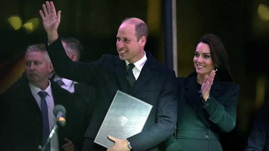 Britain's Prince William and Kate, Princess of Wales, wave to an audience as they take to the stage during ceremonies, Wednesday, Nov. 30, 2022, in Boston. Prince William said he chose to hold the second Earthshot Prize in Boston partly because it’s the home turf of the President John F. Kennedy, whose 1962 speech set the audacious goal of putting men on the moon within the decade. The couple are making their first trip to the U.S. in eight years. (AP Photo/Steven Senne)