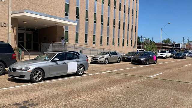 Prison reform advocates rally from inside cars for inmates vulnerable ...