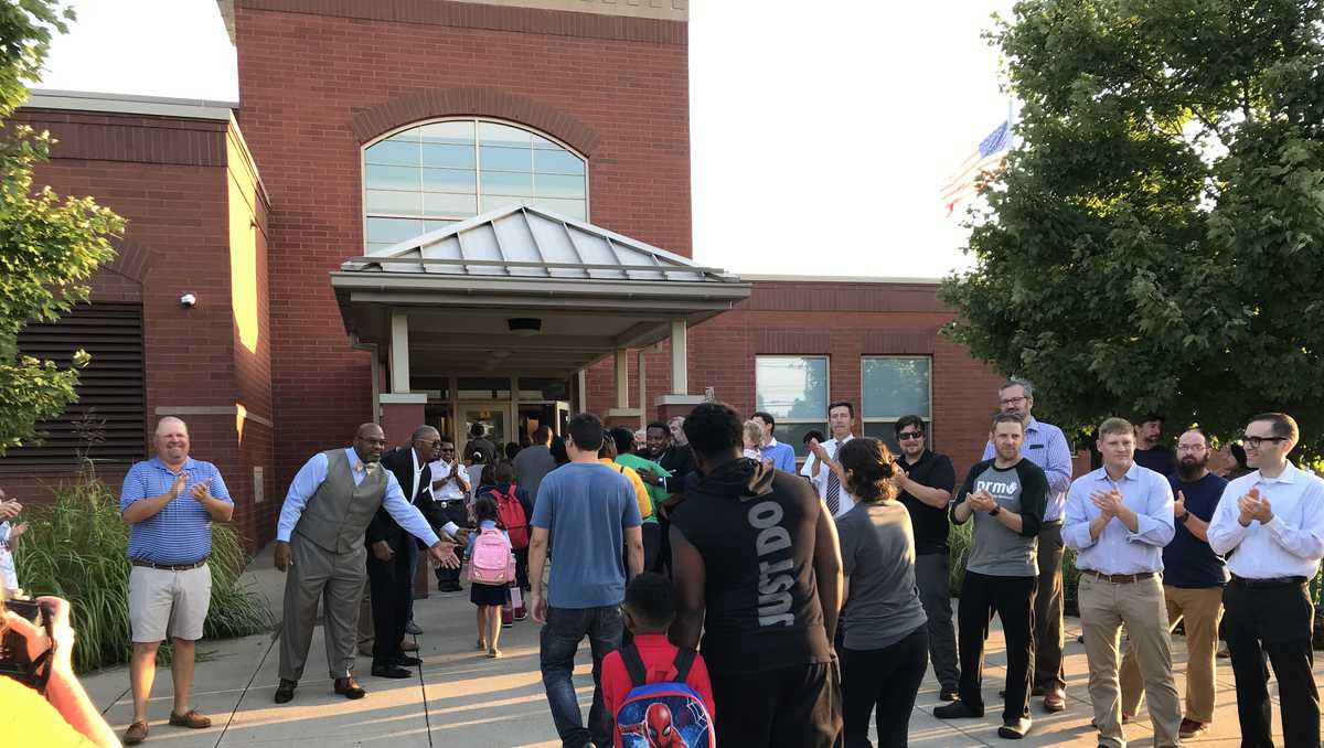 Dozens of fathers Pleasant Ridge Montessori students back to school