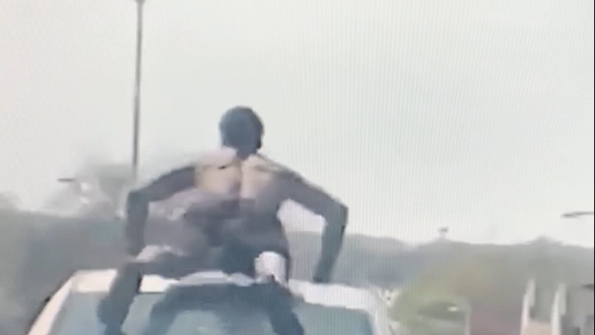 Police looking for man seen doing push-ups on moving car